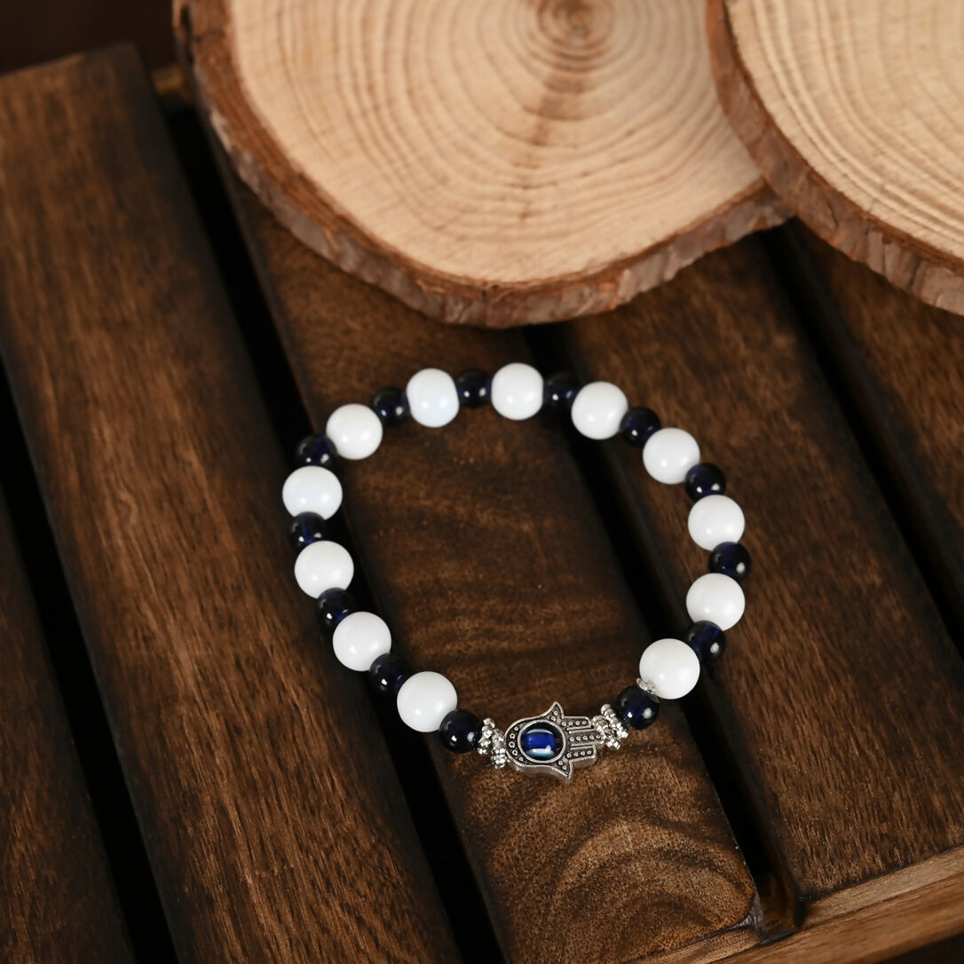 NVR Women & Men Black & White Evil Eye Elasticated Rakhi With Roli Chawal - Distacart