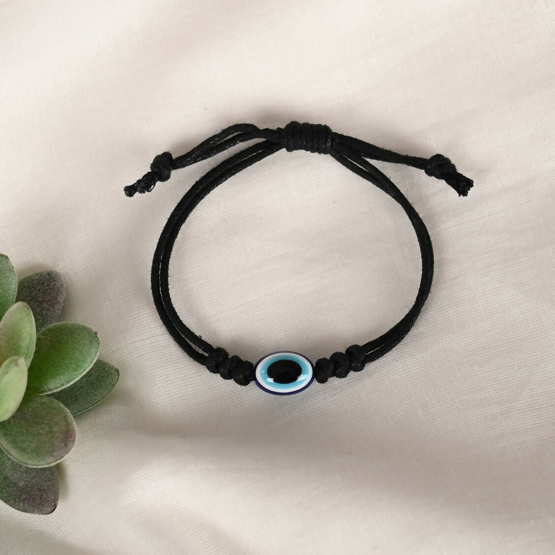 NVR Women & Men Black Evil Eye Rakhi With Roli Chawal - Distacart