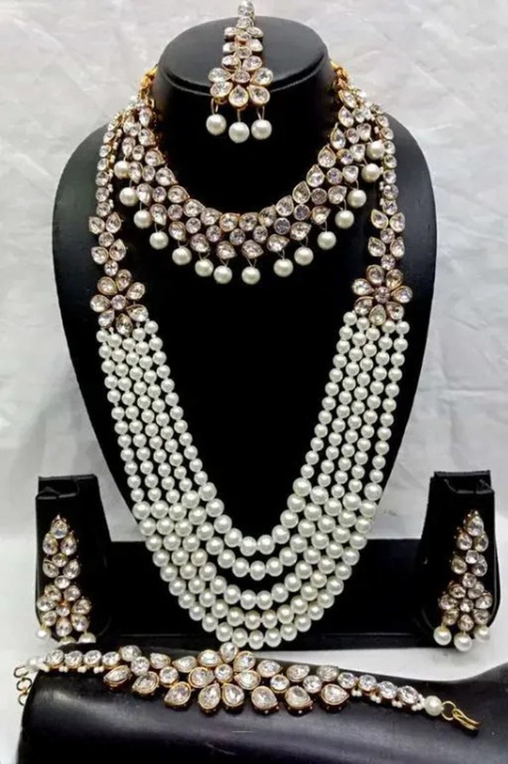 Jewel City Luxury Pearl and Crystal Bridal Jewelry Set - Traditional Indian Wedding Necklace Set with Earrings, Tikka, and Bracelet