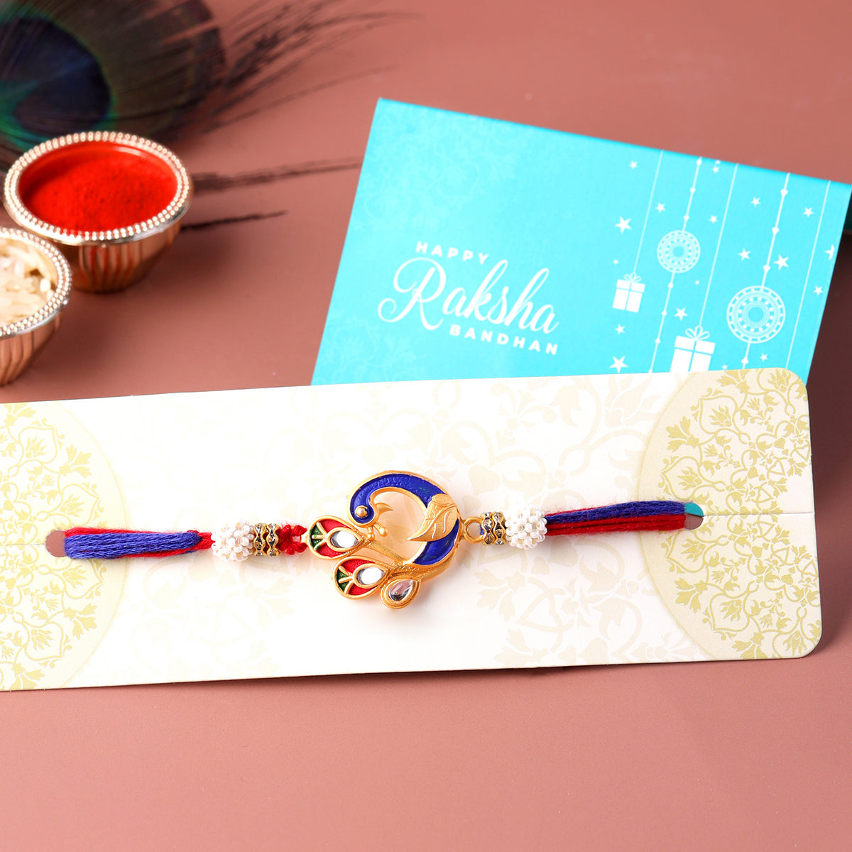 trueBrowns X Voylla Designer Enameled Peacock Rakhi With Roli Chaawal Pack