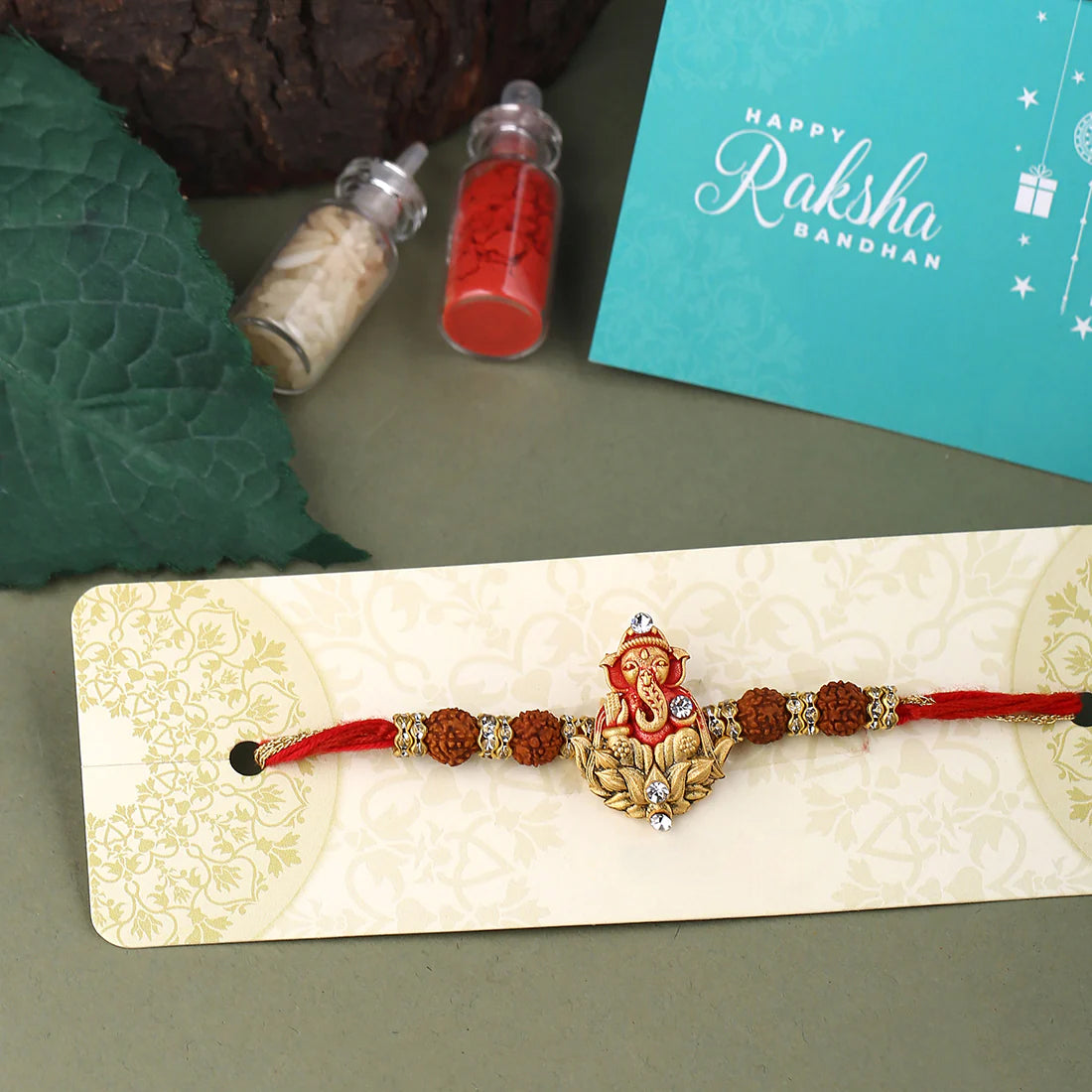 trueBrowns X Voylla Divine Rudraksha Ganesha Rakhi With Roli Chaawal Pack