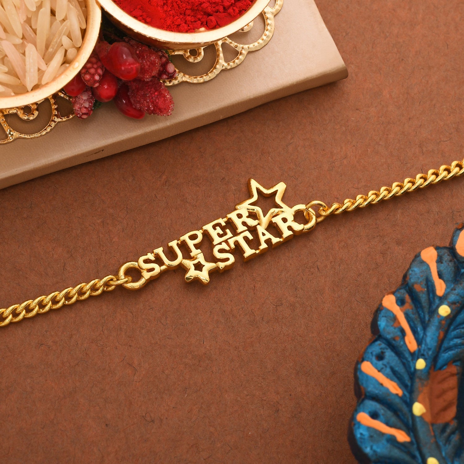 trueBrowns X Voylla Super Star Gold Tone Bracelet Style Rakhi - Distacart