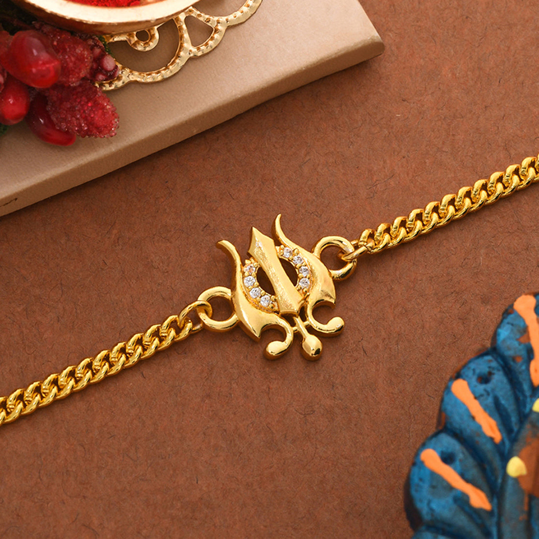 trueBrowns Yellow Gold-Polished Trishul Bracelet Rakhi - Distacart