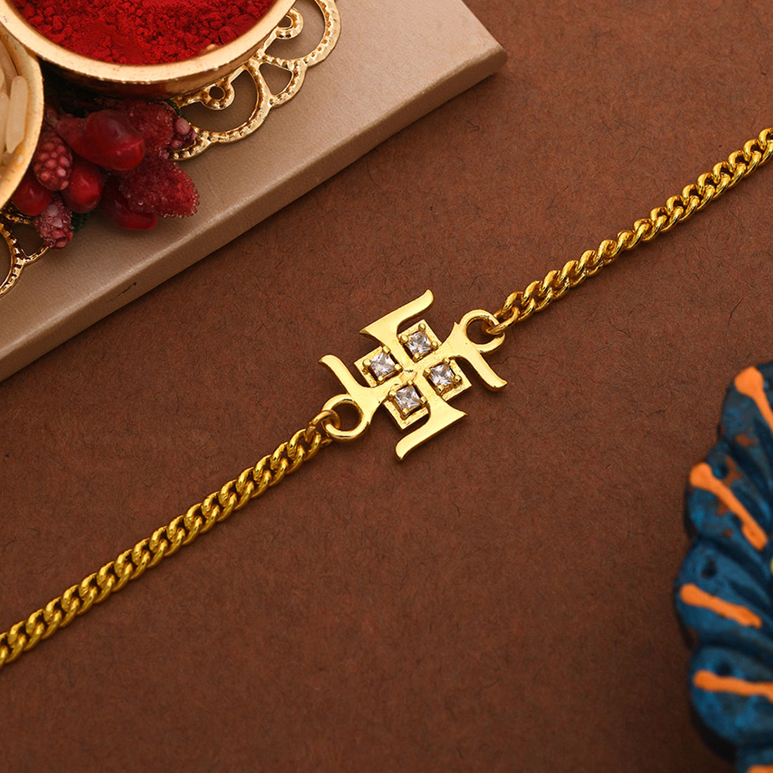 trueBrowns Auspicious Swastik Gold-Polished Bracelet Style Rakhi - Distacart