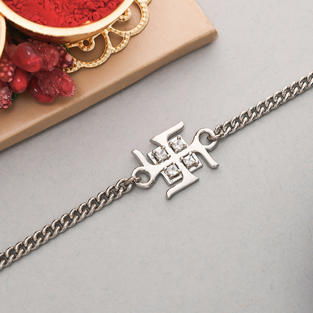 trueBrowns Auspicious Swastik Motif Silver Tone Bracelet Rakhi - Distacart