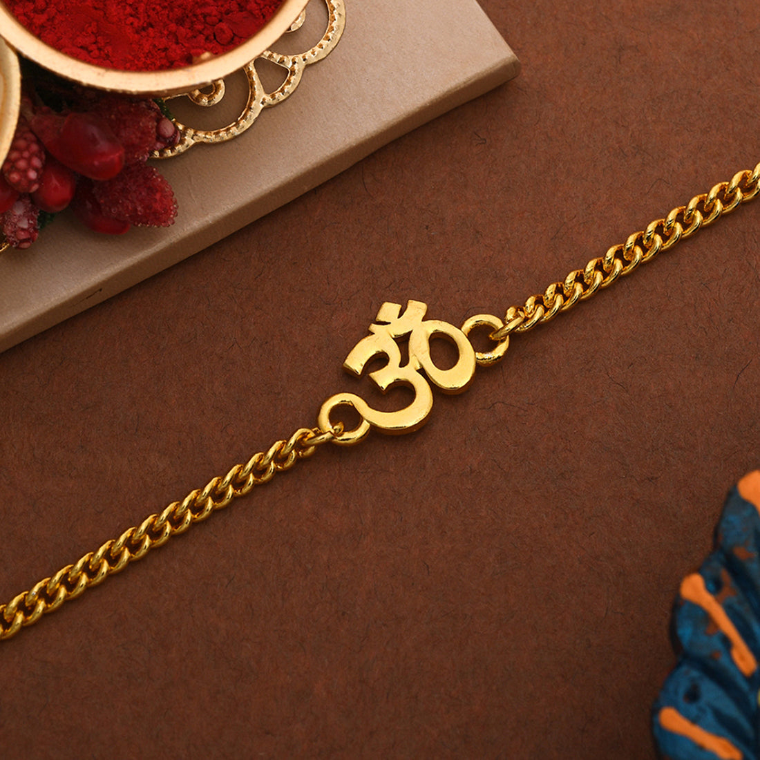 trueBrowns Auspicious Gold Tone Brass Om Bracelet Style Rakhi - Distacart