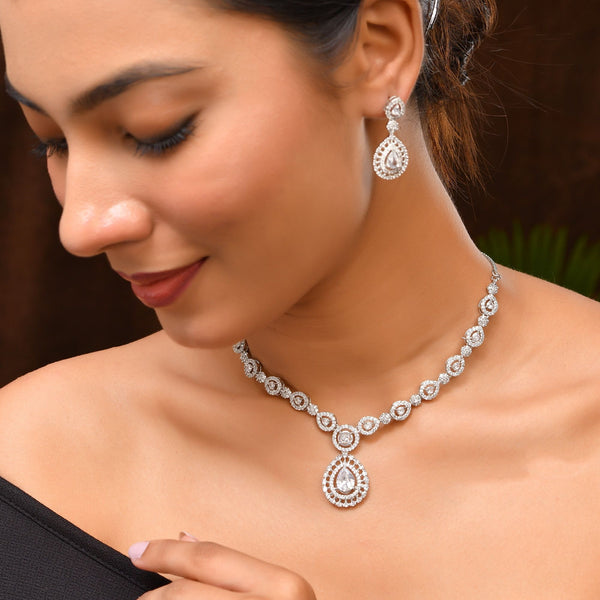 VOJ Silver Plated AD Stone Studded Elegant Necklace And Earrings Set