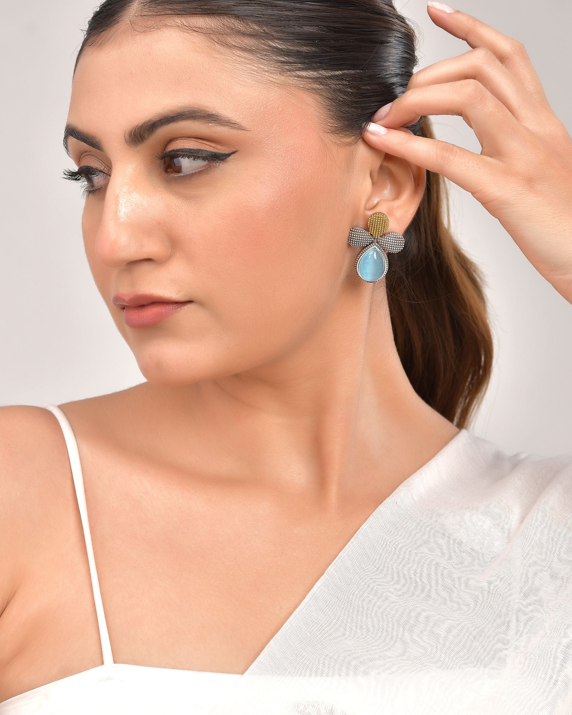 VOJ Silver Toned Blue Stone Studded Elegant Earrings
