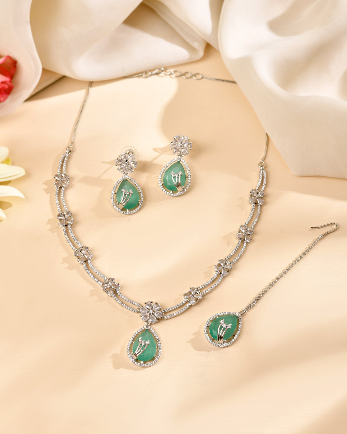 VOJ Silver Plated Teal Green Teardrop Shaped Stone And Ad Stone Jewellery Set With Maang Tikka - Dista