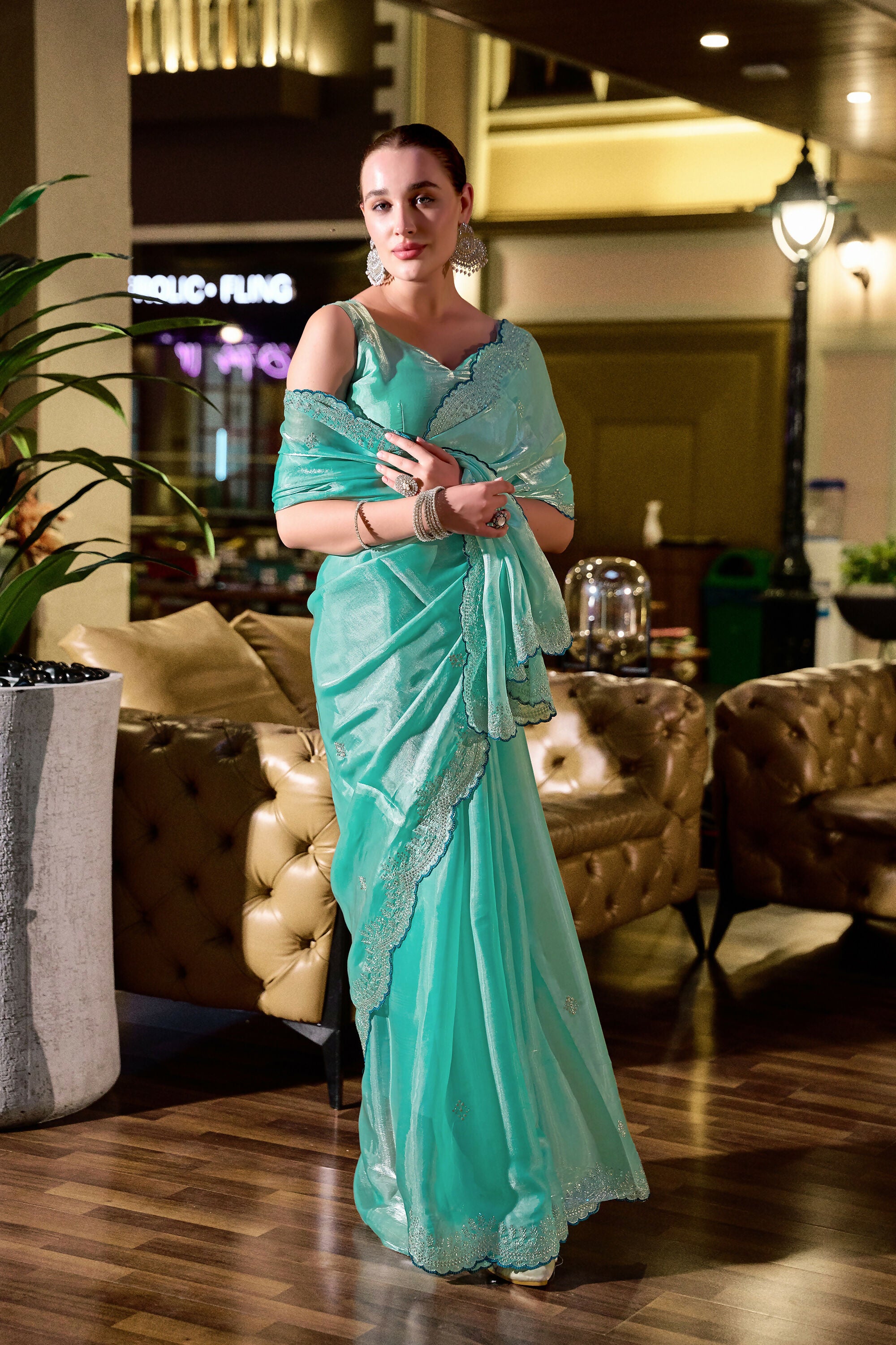 Vastranavya Turquoise Embroidery Work Shimmer Chiffon Saree with Unstitched Blouse