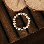 Thumbnail for NVR Women & Men Cream-colored Evil Eye Elasticated Rakhi With Roli Chawal - Distacart