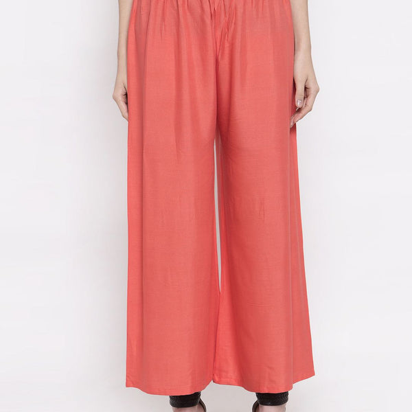 TAG 7 Women Peach-Coloured Solid Flared Palazzos - Distacart