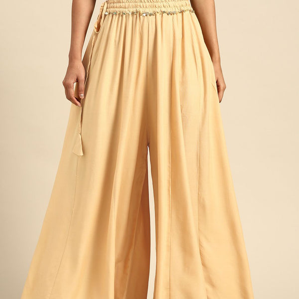 TAG 7 Women Beige Solid Flared Palazzos - Distacart