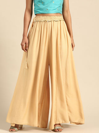 TAG 7 Women Beige Solid Flared Palazzos - Distacart