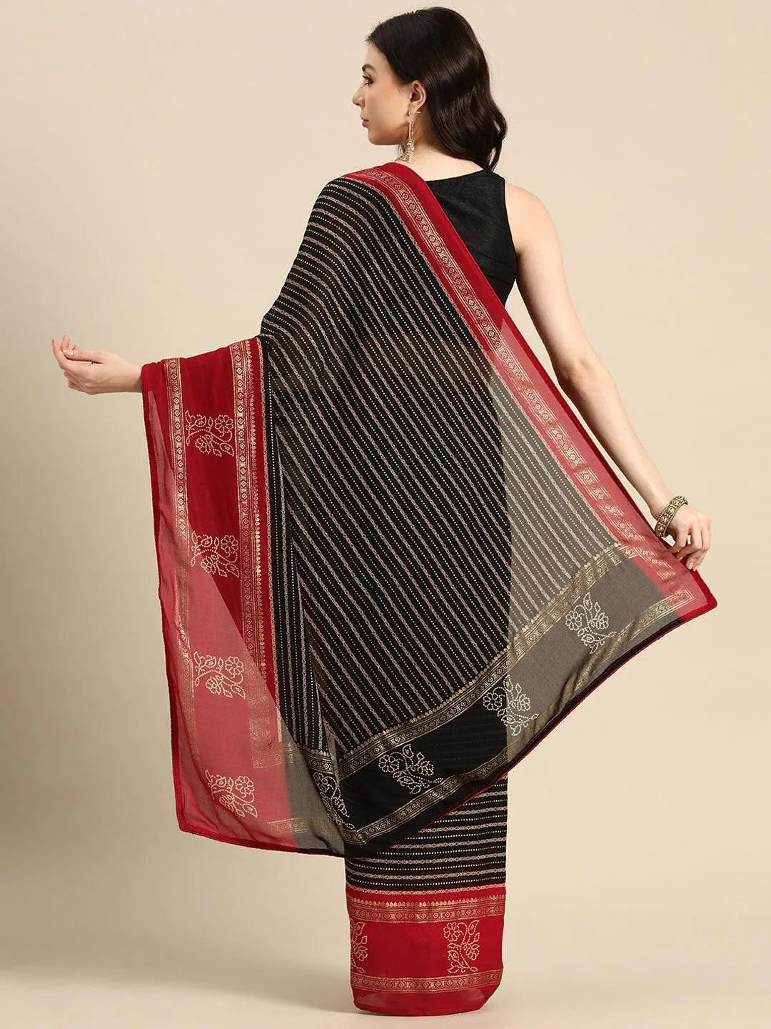 https://cdn.shopify.com/s/files/1/0341/4805/7228/files/black-printed-georgette-saree-libas-2.jpg?v=1738938115