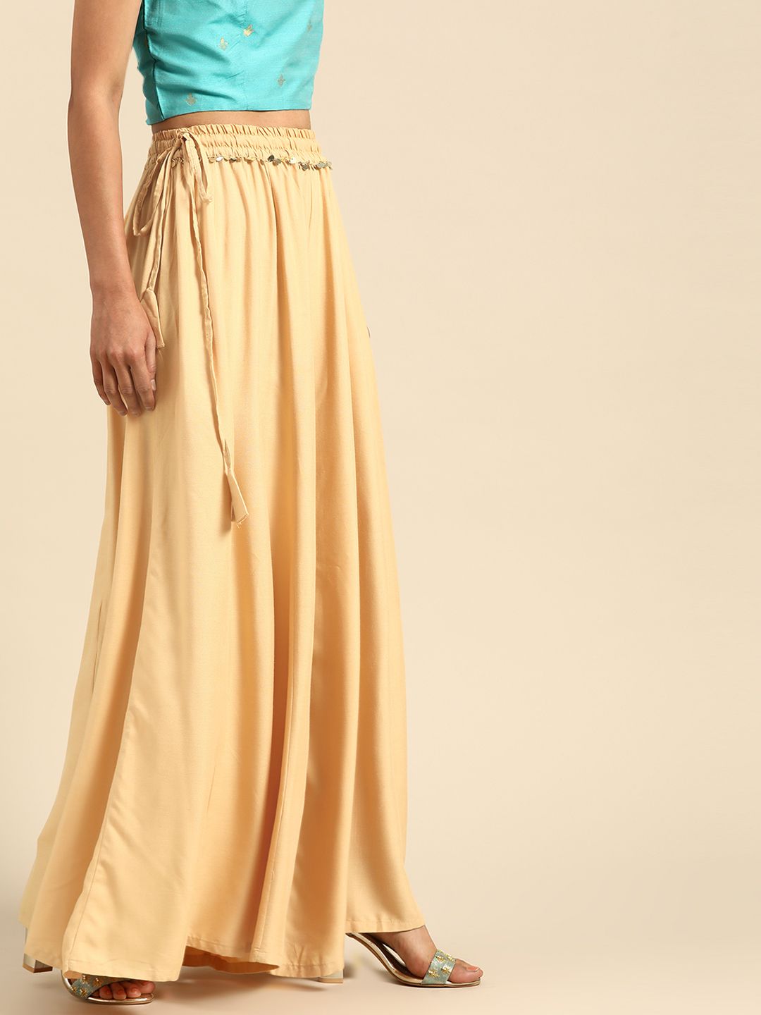 TAG 7 Women Beige Solid Flared Palazzos - Distacart