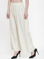 Thumbnail for TAG 7 Women Off-White Solid Flared Palazzos