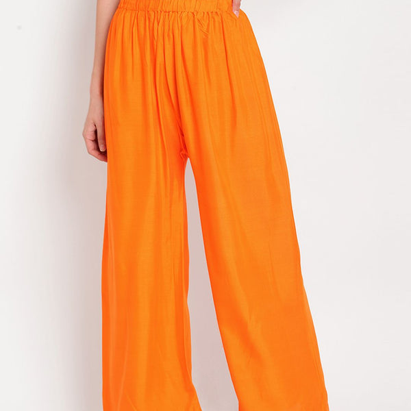TAG 7 Women Orange Solid Flared Palazzos - Distacart