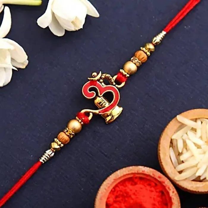 Auspicious Om Pearl Rakhi & Kaju Roll Box