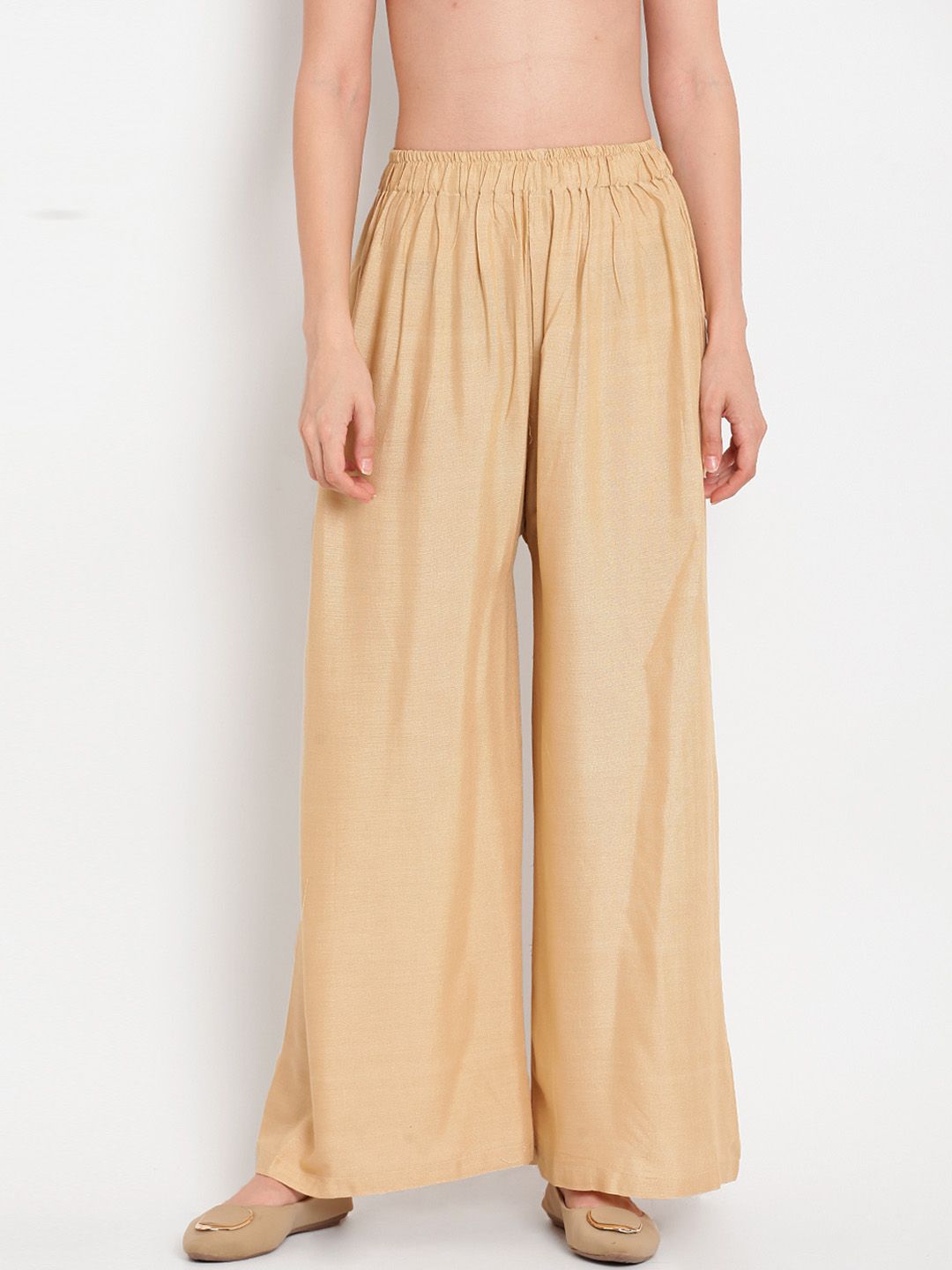 TAG 7 Women Beige Solid Flared Palazzos - Distacart