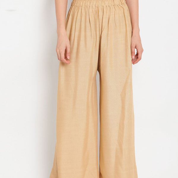 TAG 7 Women Beige Solid Flared Palazzos - Distacart
