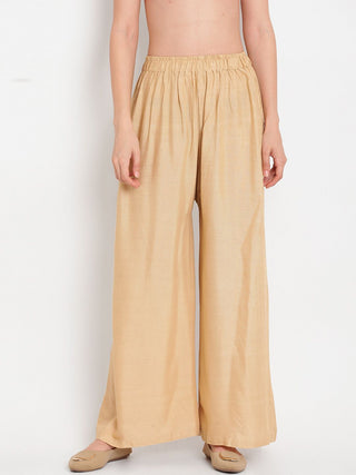 TAG 7 Women Beige Solid Flared Palazzos - Distacart