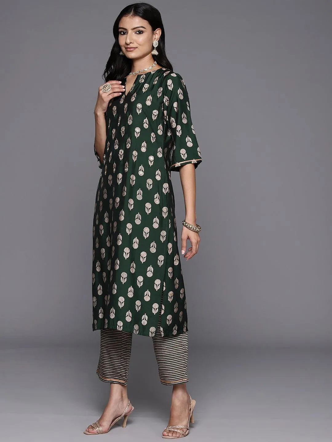 https://cdn.shopify.com/s/files/1/0341/4805/7228/files/green-printed-silk-blend-straight-kurta-with-trousers-and-dupatta-libas-3-27766389538966.jpg?v=1739181528
