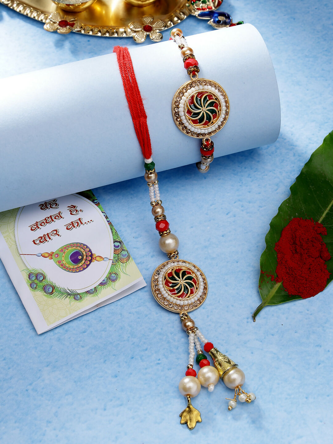 NVR Women & Men Set of 2 Gold-Toned Stone-Studded & Beaded Bhaiya Bhabi Rakhi With Roli Chawal - Distacart