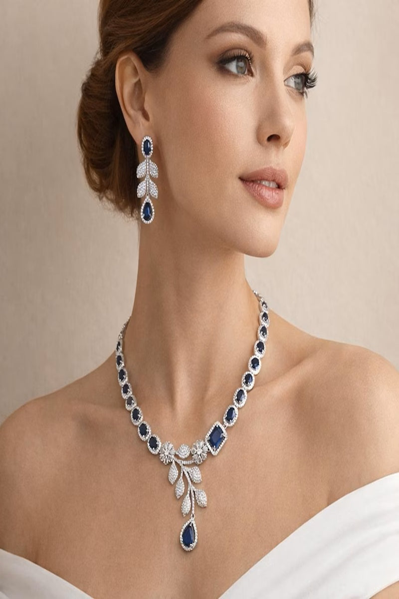 Vastrabhushan Blue Sapphire CZ Bridal Jewelry Set | Silver Plated Wedding Necklace Earrings - Dista