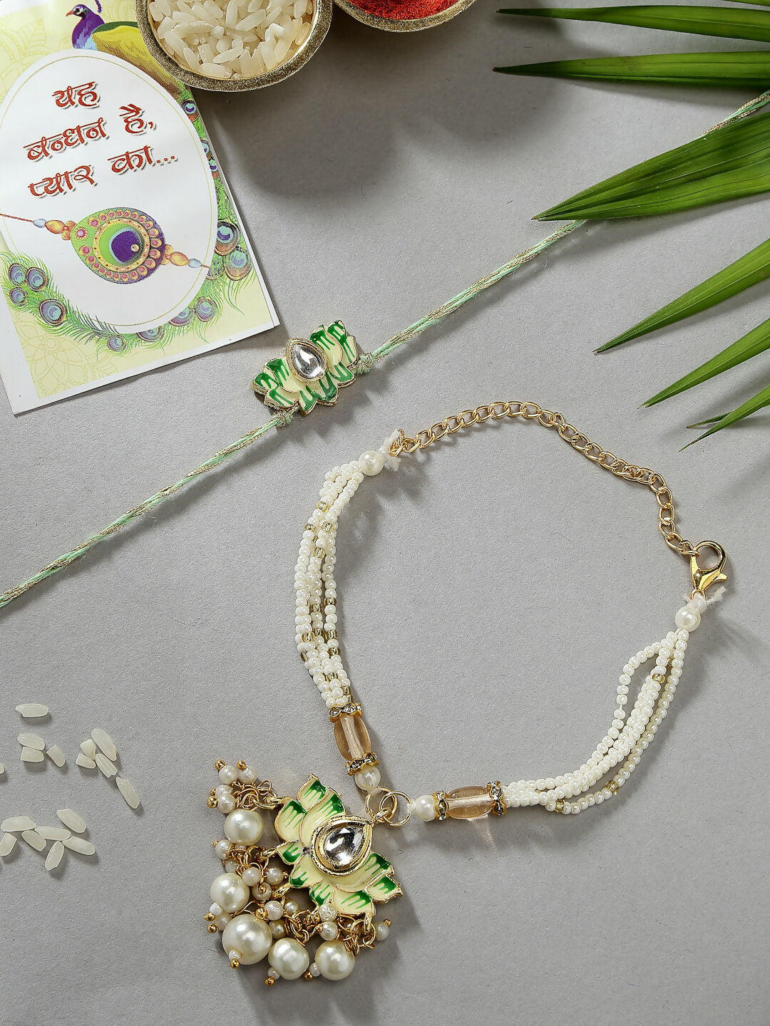 NVR Women & Men Set of 2 Green Lotus Shape Kundan-Studded & Beaded Wraparound Rakhi Set With Roli Chawal & Chocolate - Distacart