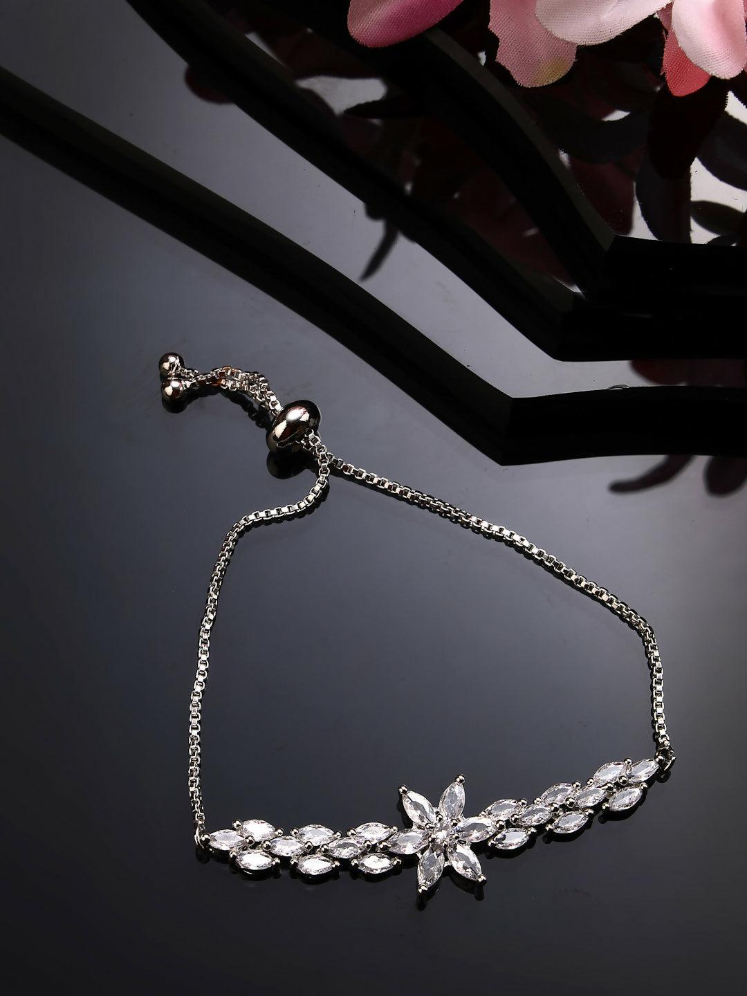 NVR Women Silver-Plated American Diamond Studded Rakhi With Roli Chawal - Distacart