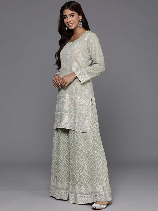 https://cdn.shopify.com/s/files/1/0341/4805/7228/files/libas-art-green-self-design-georgette-straight-kurta-with-palazzos-and-dupatta-libas-2.jpg?v=1738939382