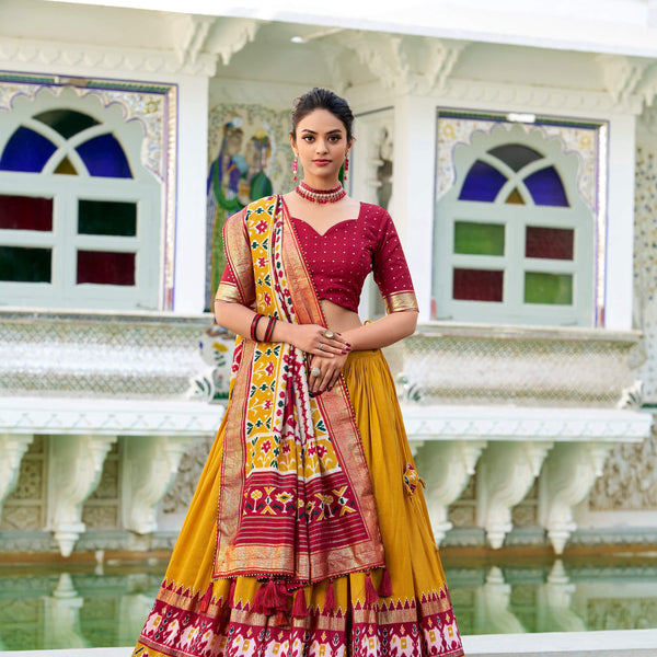 Evanik Mustard Traditional Style Tussar Silk Patola Print With Foil Work Unstitched Lehenga Choli