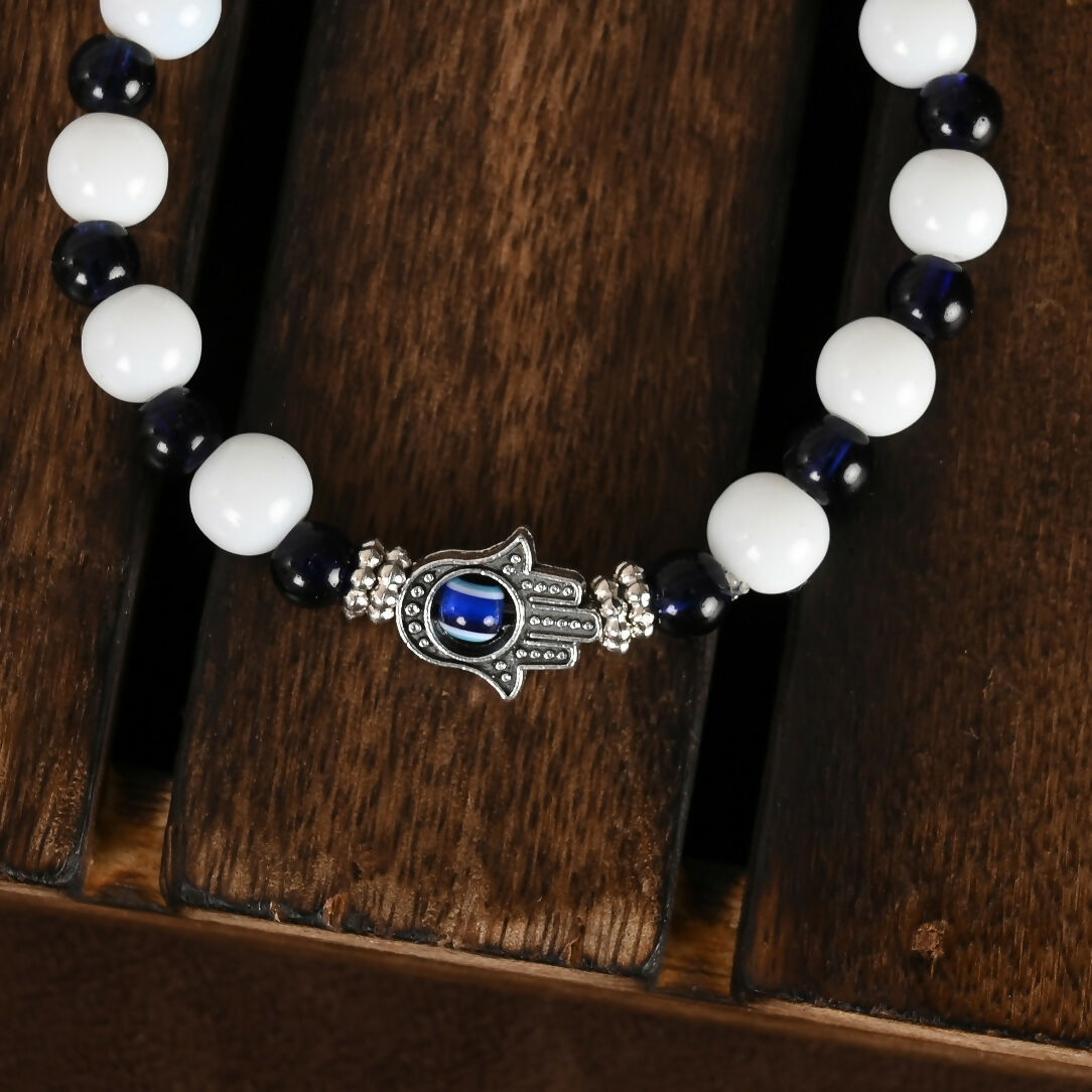 NVR Women & Men Black & White Evil Eye Elasticated Rakhi With Roli Chawal - Distacart