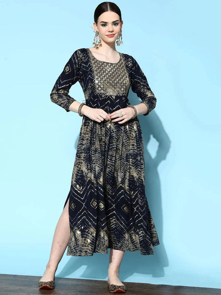 https://cdn.shopify.com/s/files/1/0341/4805/7228/files/navy-blue-printed-rayon-fit-and-flared-dress-libas-1.jpg?v=1739182719