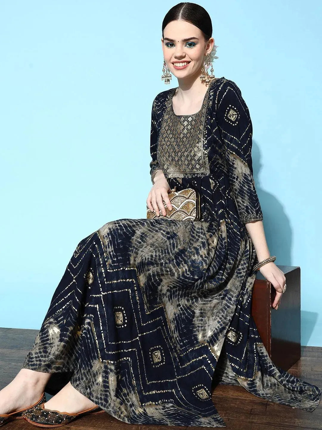 https://cdn.shopify.com/s/files/1/0341/4805/7228/files/navy-blue-printed-rayon-fit-and-flared-dress-libas-3.jpg?v=1739182719