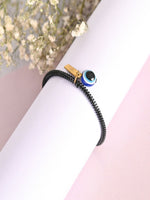 Thumbnail for NVR Women & Men Black Evil Eye Spring Ring Rakhi With Roli Chawal - Distacart