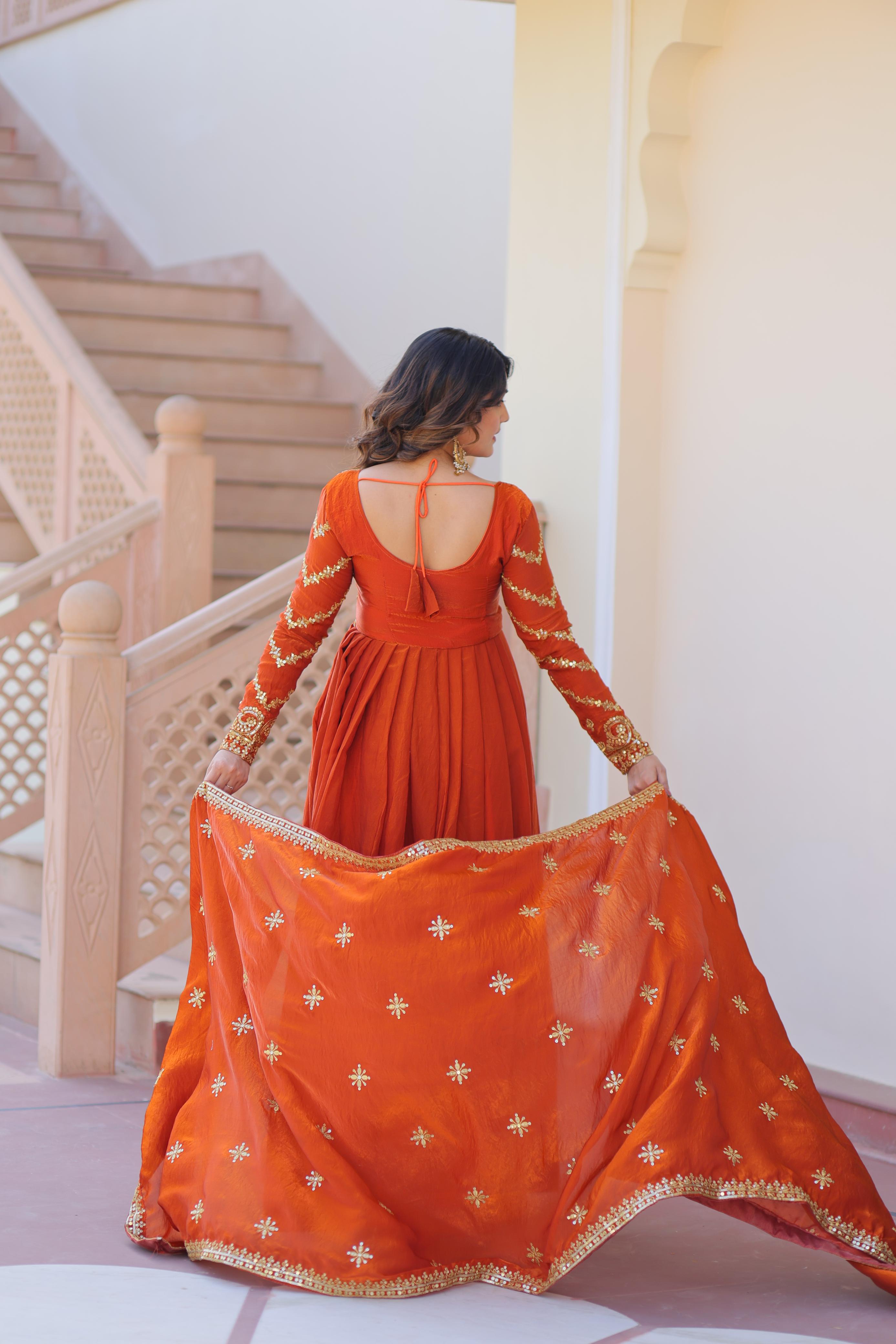 Evanik Orange Fendy Fabric With Zari & Sequins Embroidered work Gown Dupatta