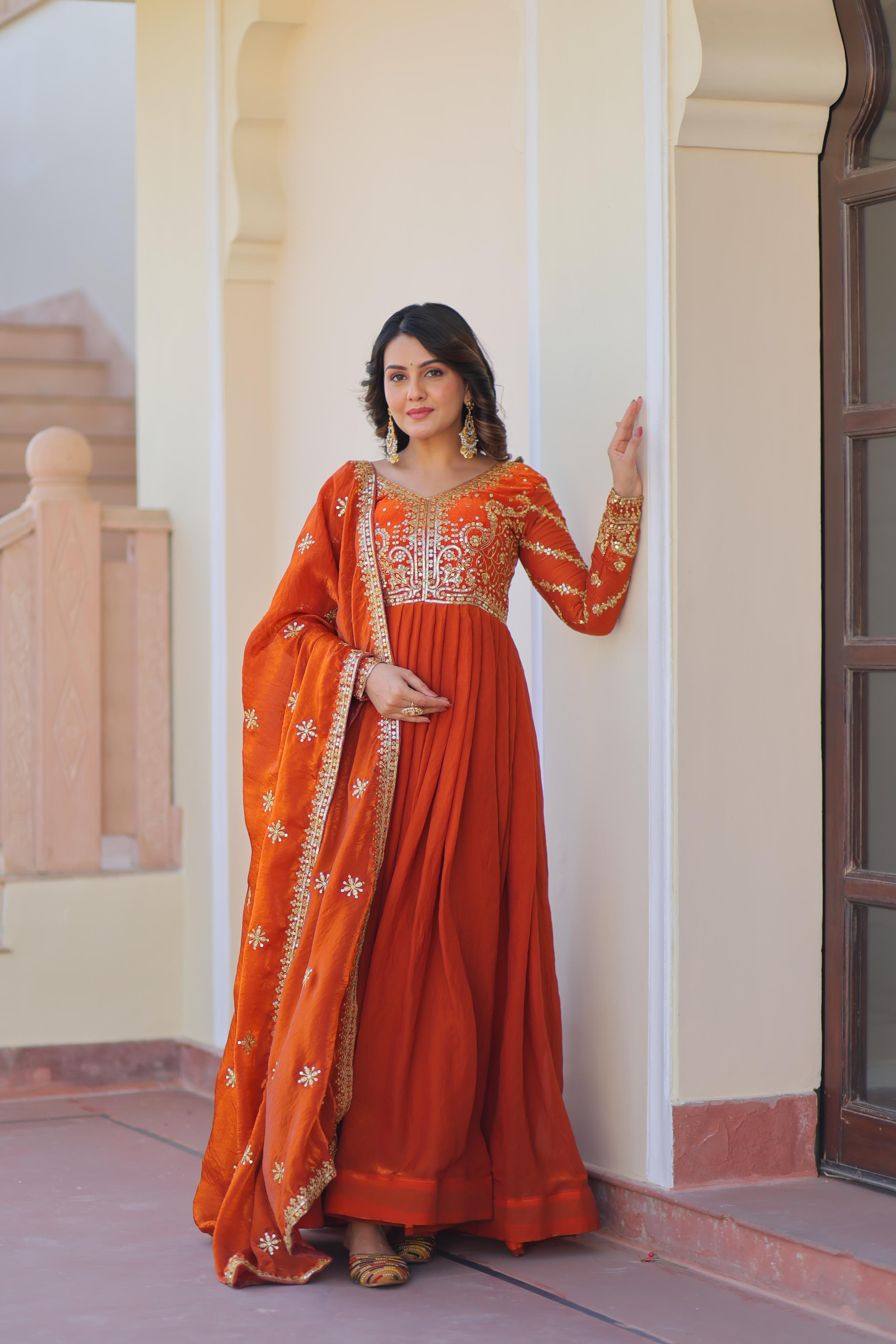 Evanik Orange Fendy Fabric With Zari & Sequins Embroidered work Gown Dupatta