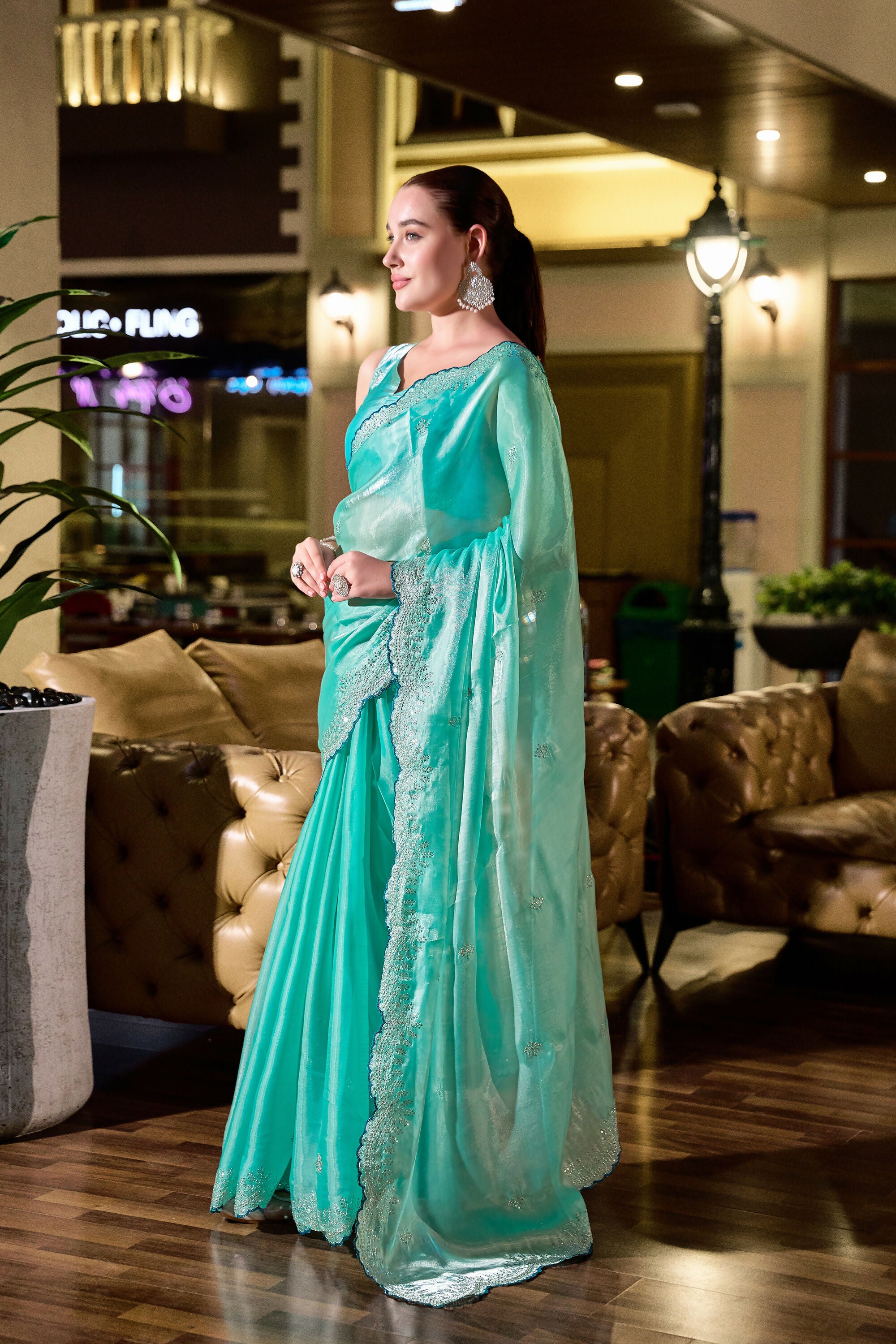 Vastranavya Turquoise Embroidery Work Shimmer Chiffon Saree with Unstitched Blouse