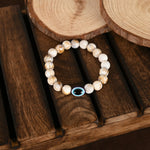 Thumbnail for NVR Women & Men Cream-colored Evil Eye Elasticated Rakhi With Roli Chawal - Distacart