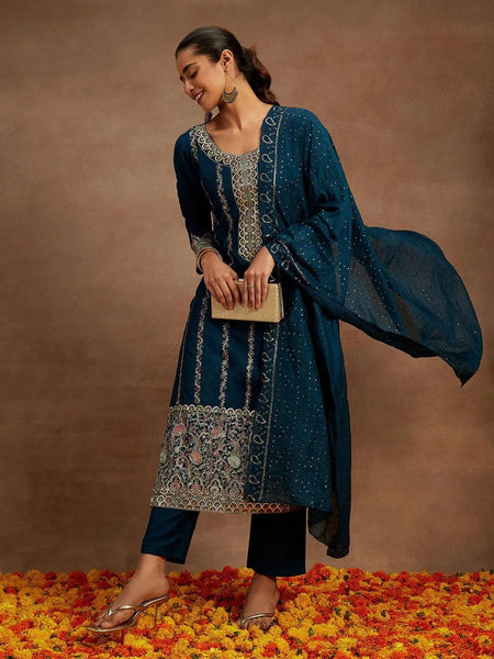 https://cdn.shopify.com/s/files/1/0341/4805/7228/products/teal-embroidered-silk-straight-kurta-with-trousers-and-dupatta-libas-1-27767401742486.jpg?v=1739541669
