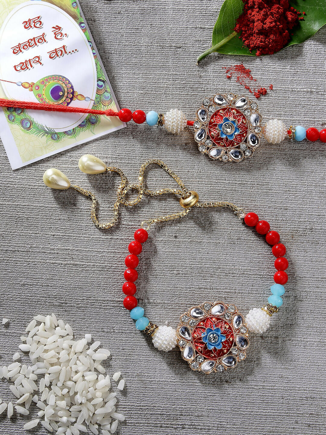 NVR Women & Men Set of 2 Red-colored Stone-Studded & Beaded Bhaiya Bhabhi Rakhi With Roli Chawal & Chocolate - Distacart