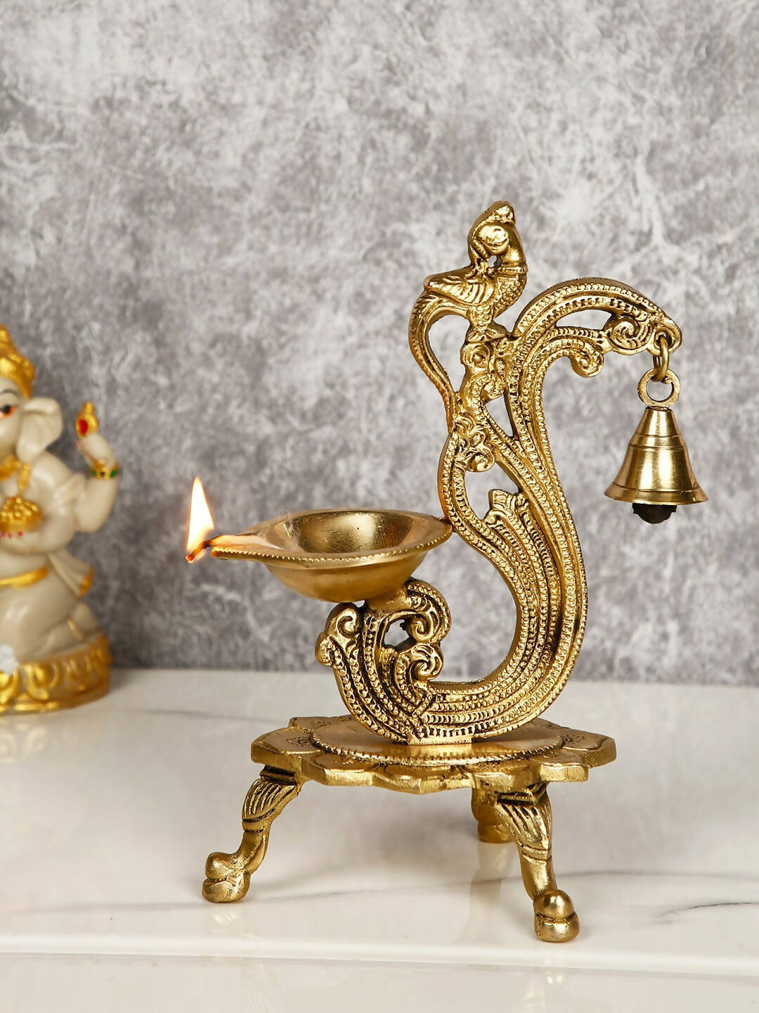 CraftVatika Gold-Toned Brass Handmade Decorative Peacock Design Diya with Bell & Stand - Distacart