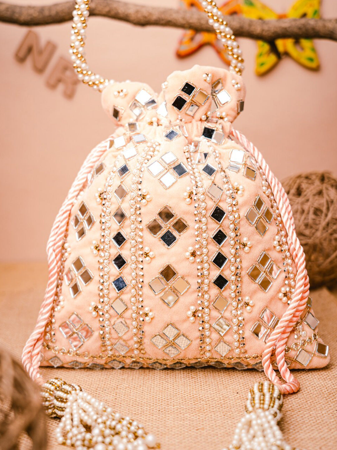NR By Nidhi Rathi Peach-Coloured & White Embroidered Potli Clutch - Distacart