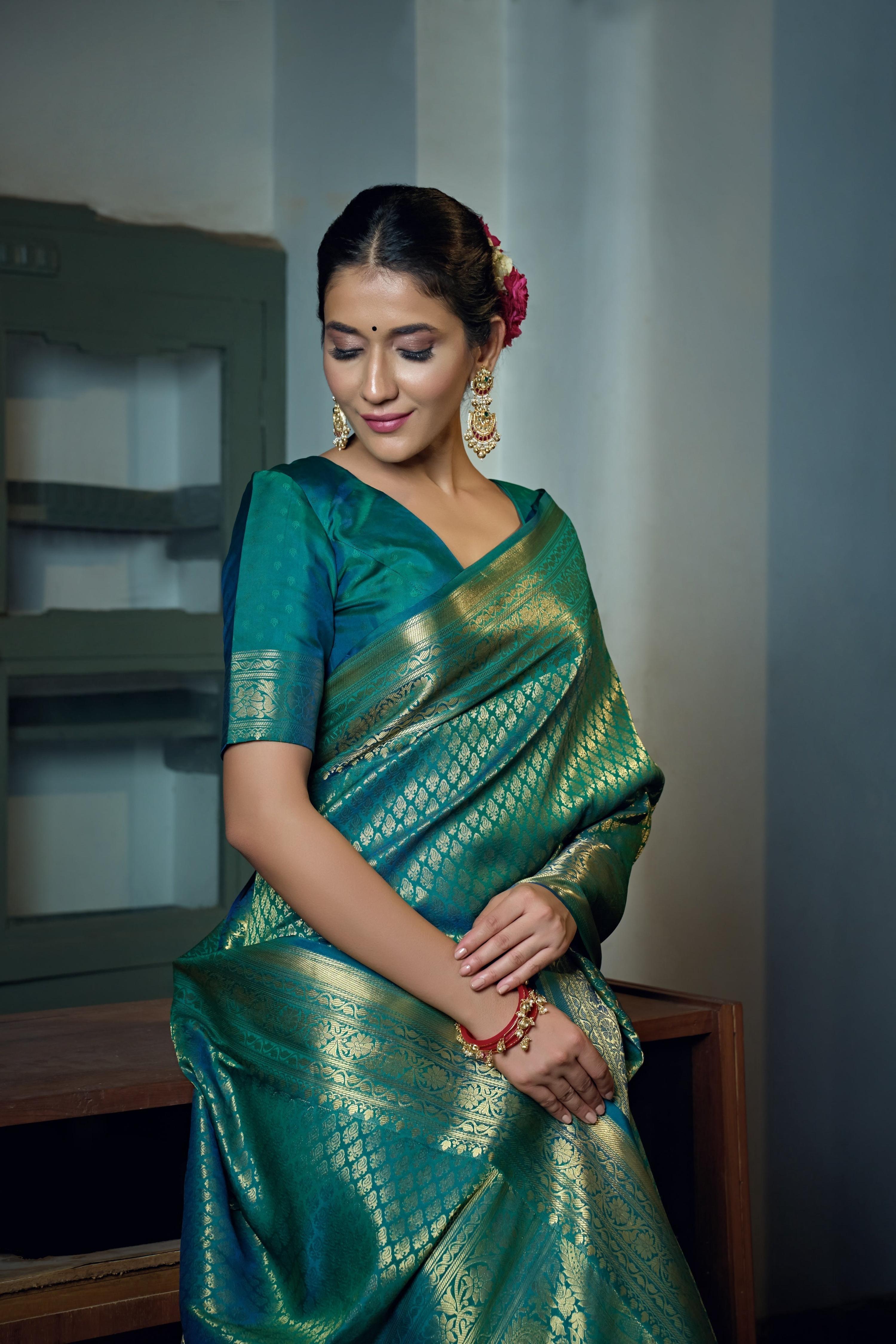 Vardha Teal Blue Golden Zari Kanjeevaram Silk Saree