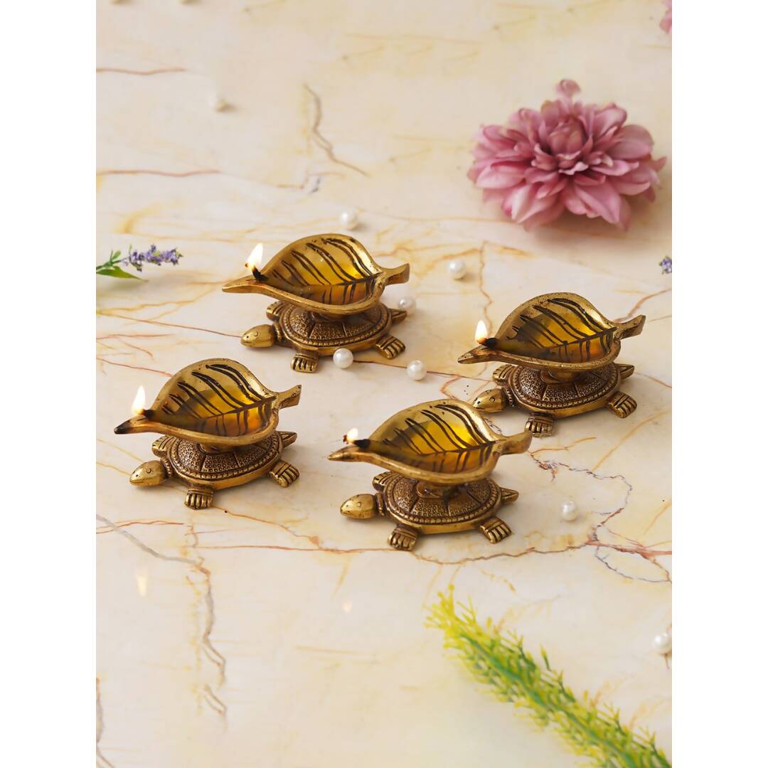 eCraftIndia 4 Pieces Beige Tortoise Statue Leaf Design Diyas - Distacart