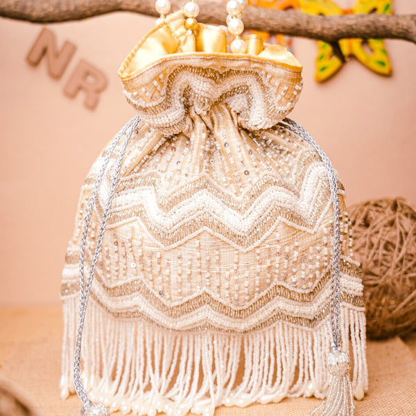 NR By Nidhi Rathi Cream-Coloured & Gold-Toned Embellished Potli Clutch - Distacart