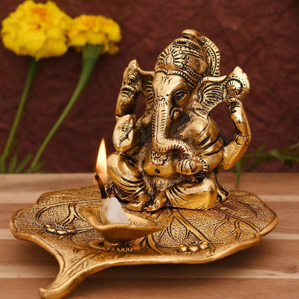 CraftVatika Gold Toned Aluminium Ganesh with Diya Idol - Distacart