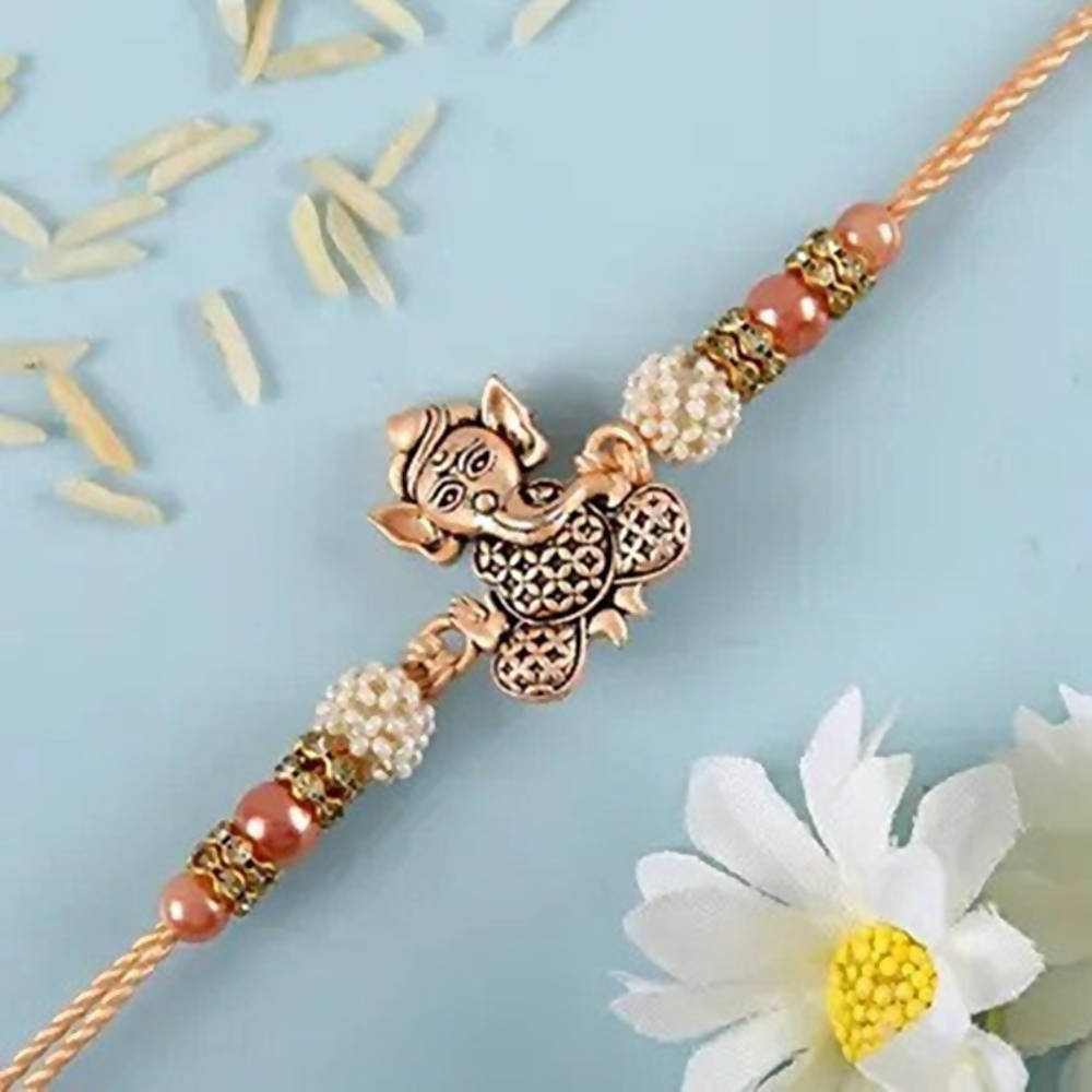 Enticing Ganesha Rakhi & Snickers Almond Chocolate online